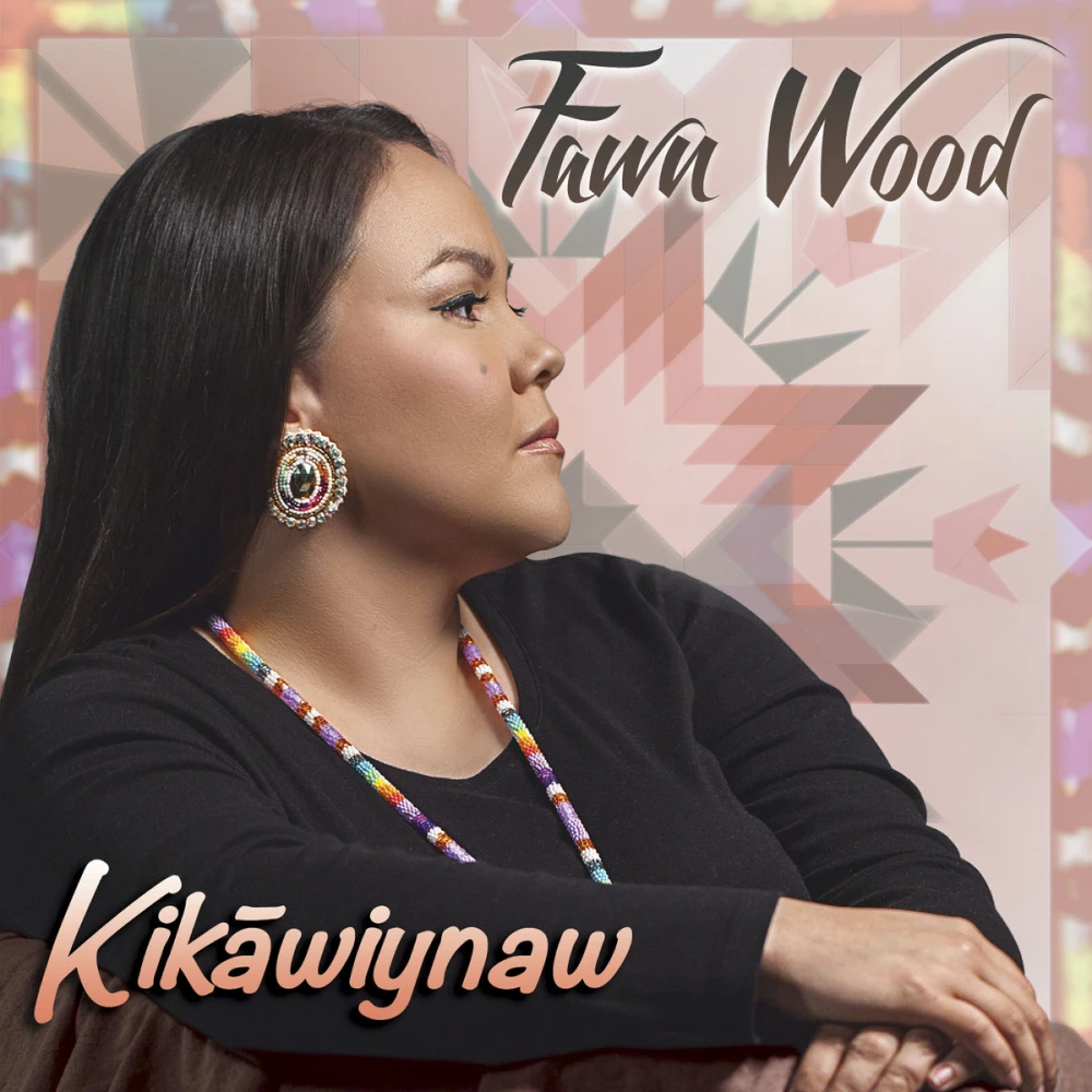 Native American woman sitting with her hands folded, facing off to the side. She’s wearing a black long sleeve tee-shirt and colorful earrings and necklace. There’s a pastel Native American pattern in the background. Her name and the title are overlaid in feminine fonts.